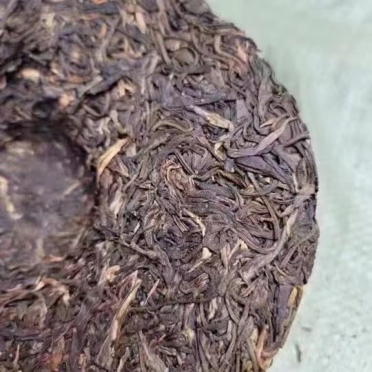 Yiwu Tongqing Hao Qiaomu Ancient Tree Raw Pu-Erh Tea 2003 – 357g