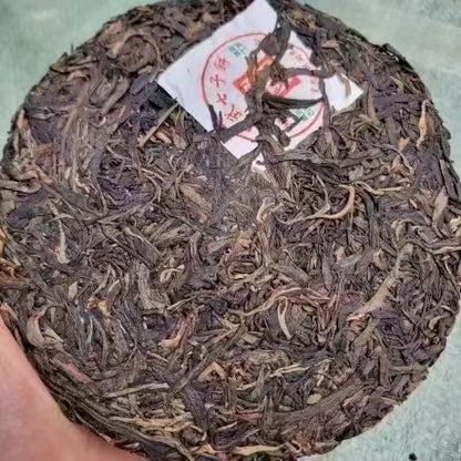 Yiwu Tongqing Hao Qiaomu Ancient Tree Raw Pu-Erh Tea 2003 – 357g