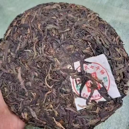 Yiwu Tongqing Hao Qiaomu Ancient Tree Raw Pu-Erh Tea 2003 – 357g