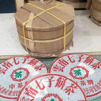 1999 China Tea Provincial Company Dry Storage Iron Discus Raw Pu-erh Tea Cake, 357g