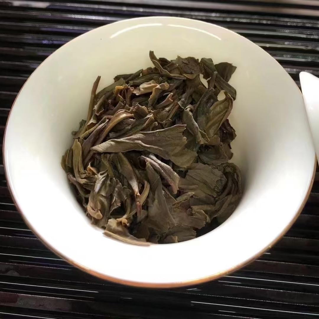 Xinghai Tea Factory Ancient Tree Ban Zhang King Raw Pu-Erh Tea 2006 – 357g