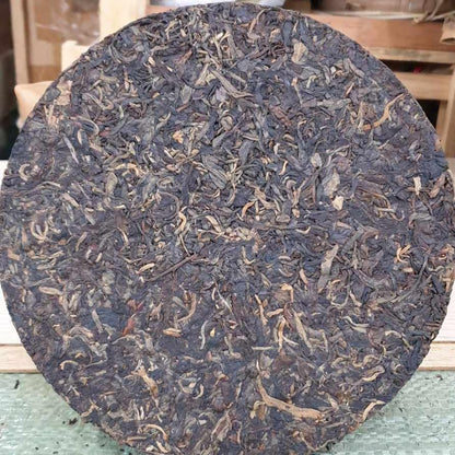 1999 China Tea Provincial Company Dry Storage Iron Discus Raw Pu-erh Tea Cake, 357g