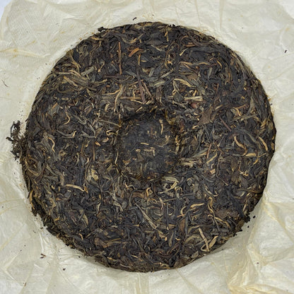 Yiwu Tongqing Hao Qiaomu Ancient Tree Raw Pu-Erh Tea 2003 – 357g