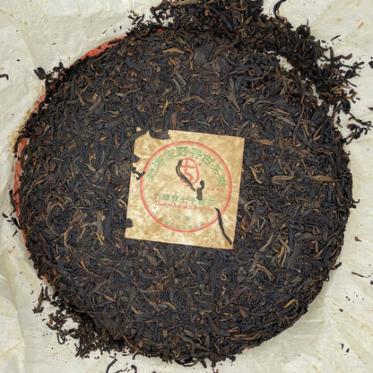 2004 Dian Yi Hao Menghai Wild Fragrance Ancient Tree Raw Pu-erh Tea Cake, 400g, from Yunnan